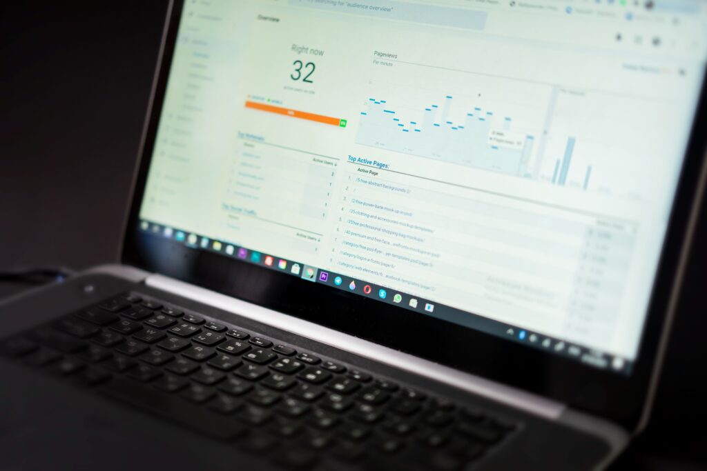 Stock photo of a laptop displaying an analytics dashboard; not Search Console or a real AI Overview tracking report