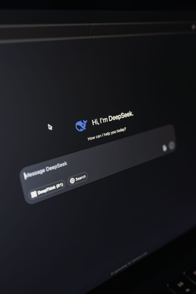Stock photograph of a laptop screen showing an AI chatbot interface in dark mode, used to illustrate generative engine optimization