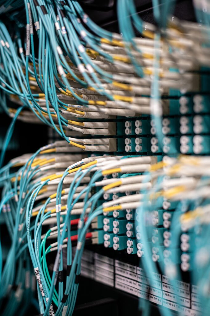 Stock photograph of blue network cables plugged into a server patch panel, used as a visual metaphor for links between pages. Not a diagram of any real website.